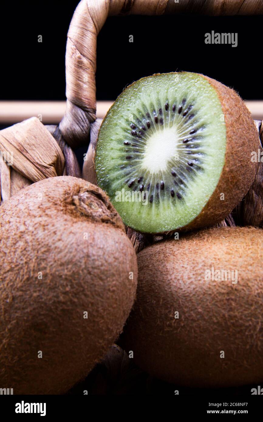 Some kiwi fruits in a basket. Kiwis are a rich source of vitamin C