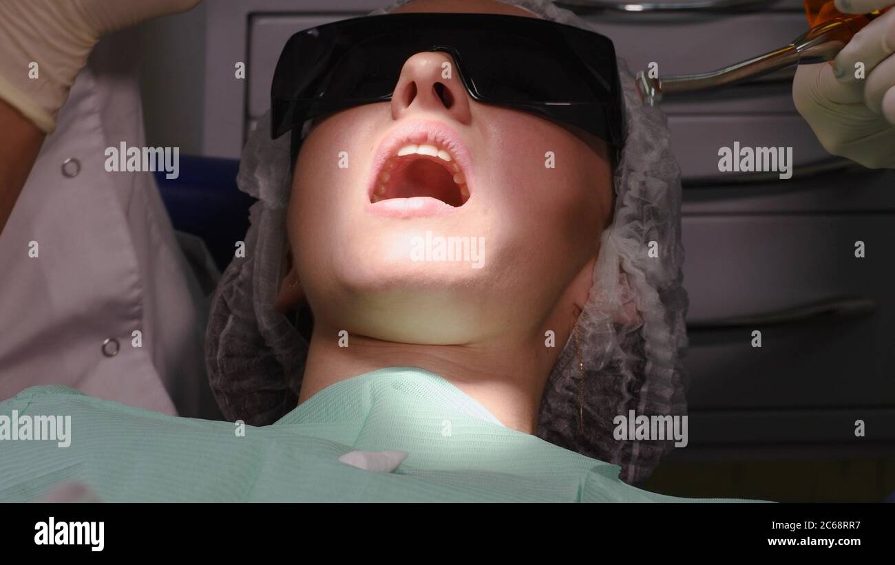 Young woman at dental clinic Stock Photo