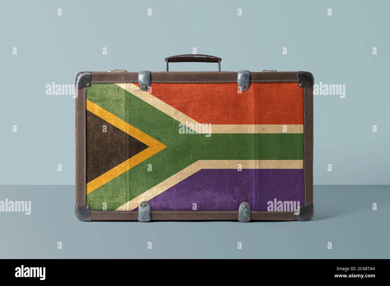 South Africa flag on old vintage leather suitcase with national concept