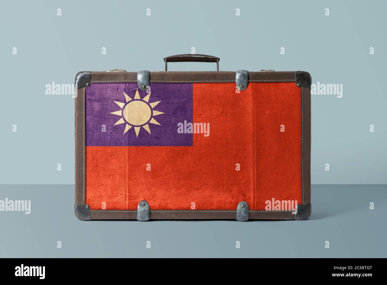 Taiwan flag on old vintage leather suitcase with national concept