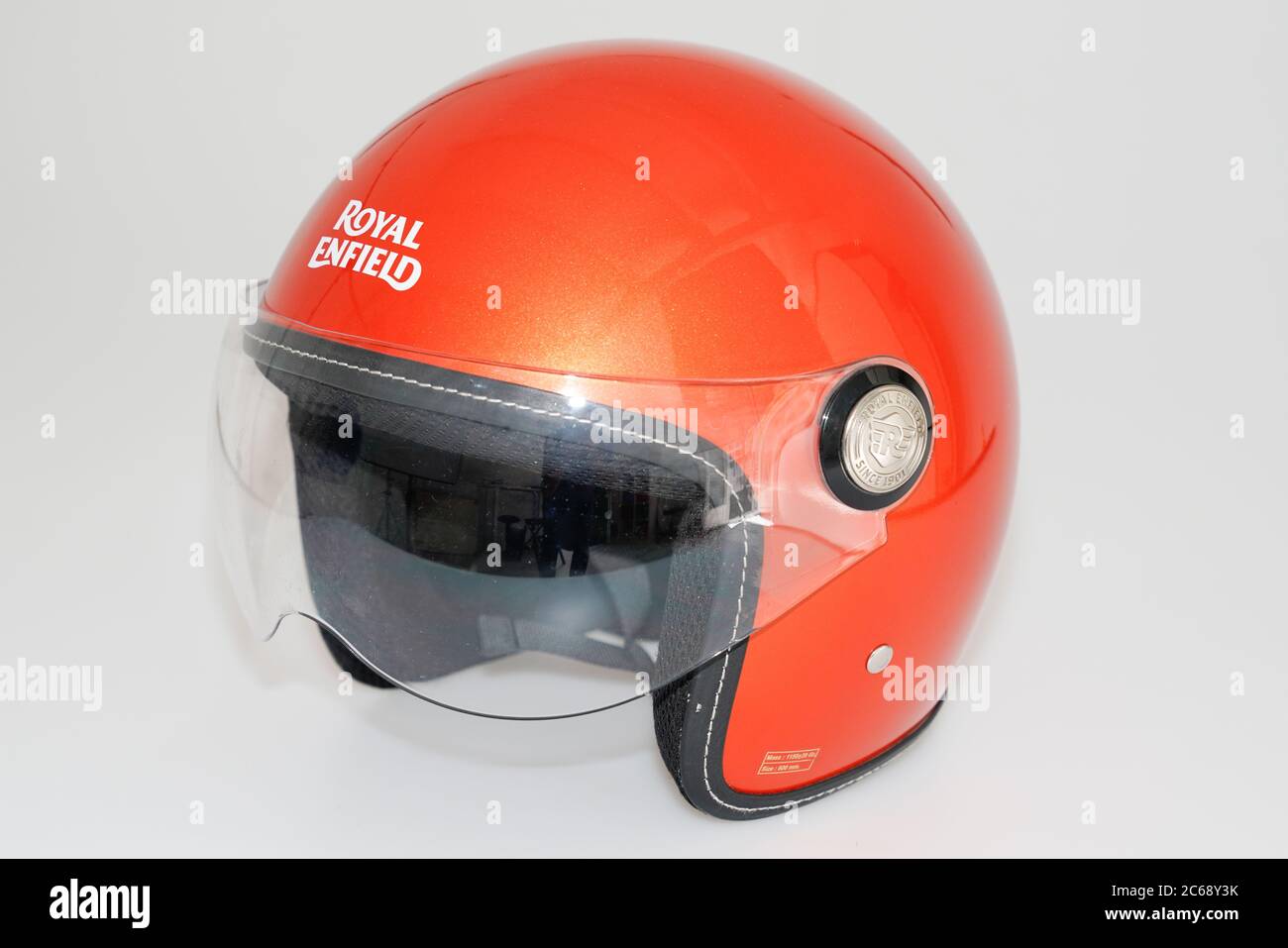 Bordeaux , Aquitaine / France - 07 05 2020 : Royal Enfield logo sign on retro orange helmet safety worn to protect motorbike man head Stock Photo