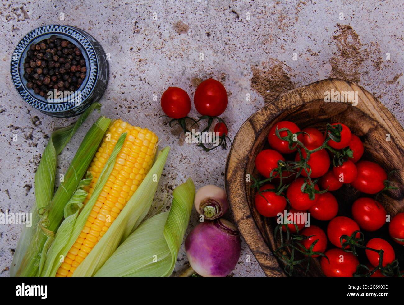 Tomatoes, turnips, corn, parsley and black pepper. Stock Photo