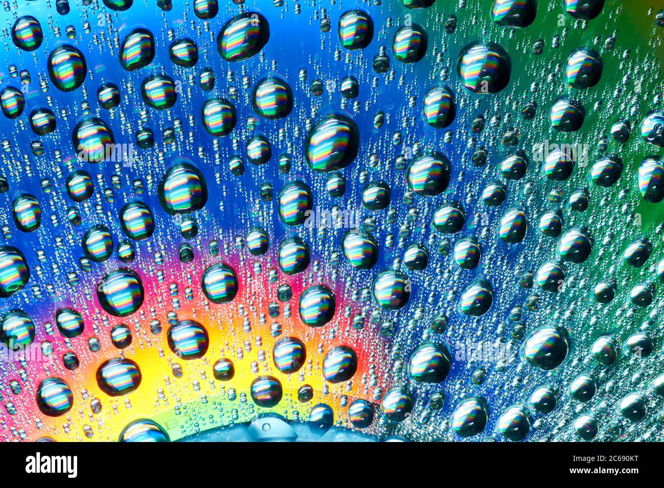 Macro of water drops on multicolor background Stock Photo - Alamy