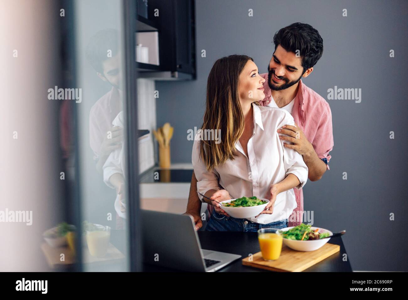 Couple enjoying breakfast time together at home. Stock Photo