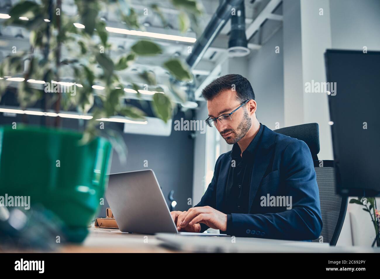 Young attractive business man typing hi-res stock photography and ...