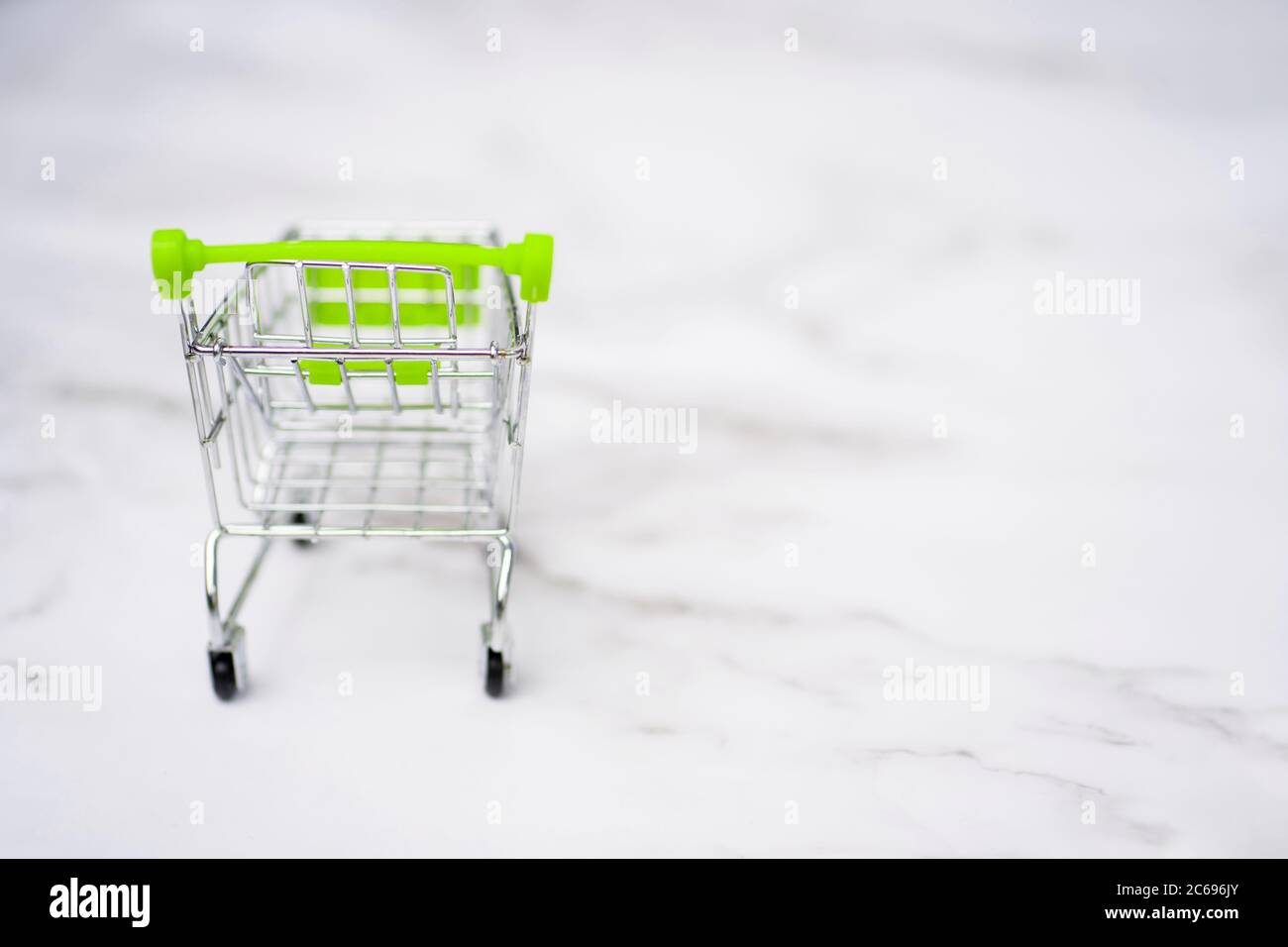shopping cart. Copy space for text or design. Stainless steel shopping trolley upside down. Minimalist shopping concept. Stock Photo