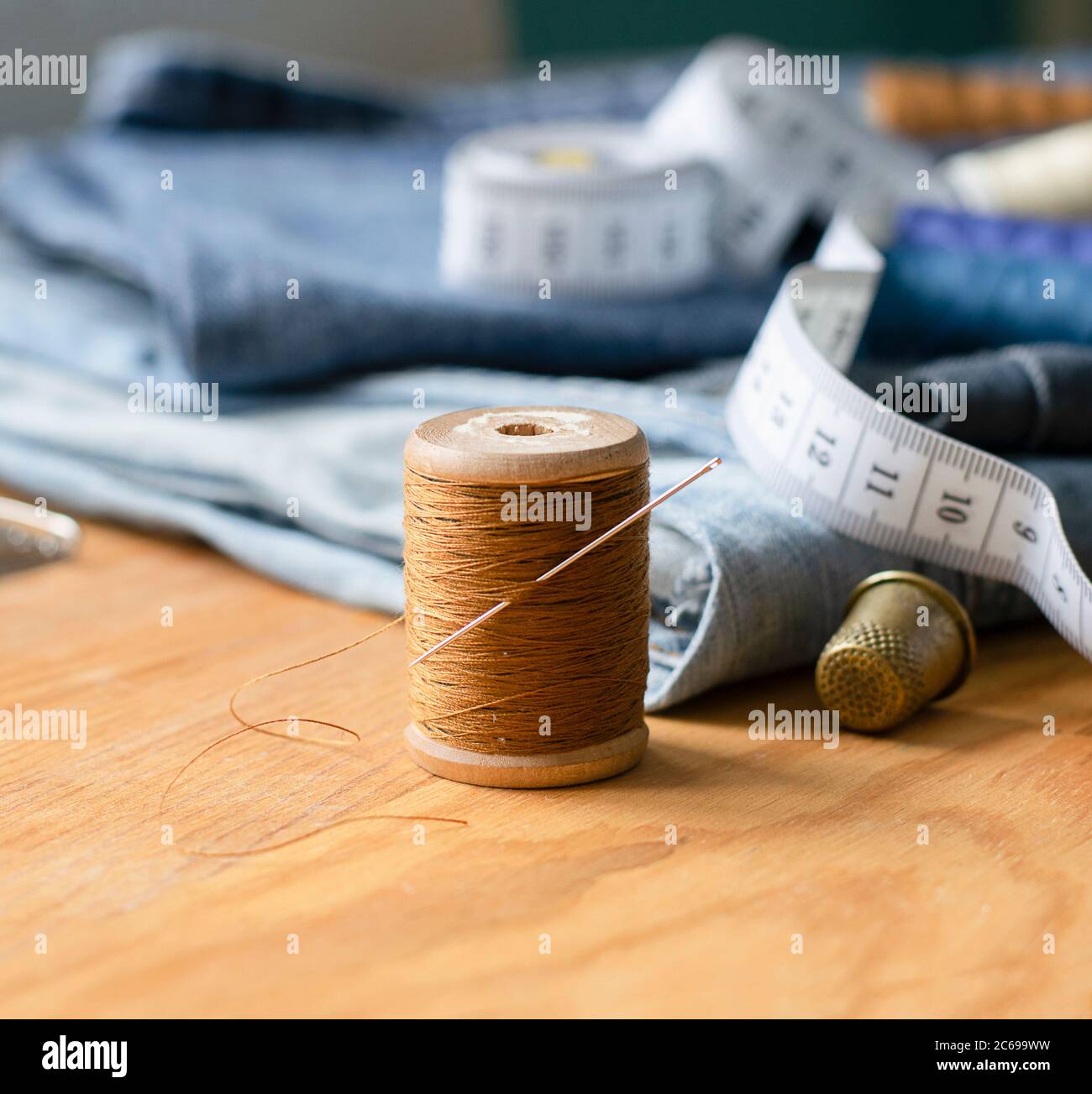 Handicraft, repair tailoring. Sewing accessories threads closeup denim