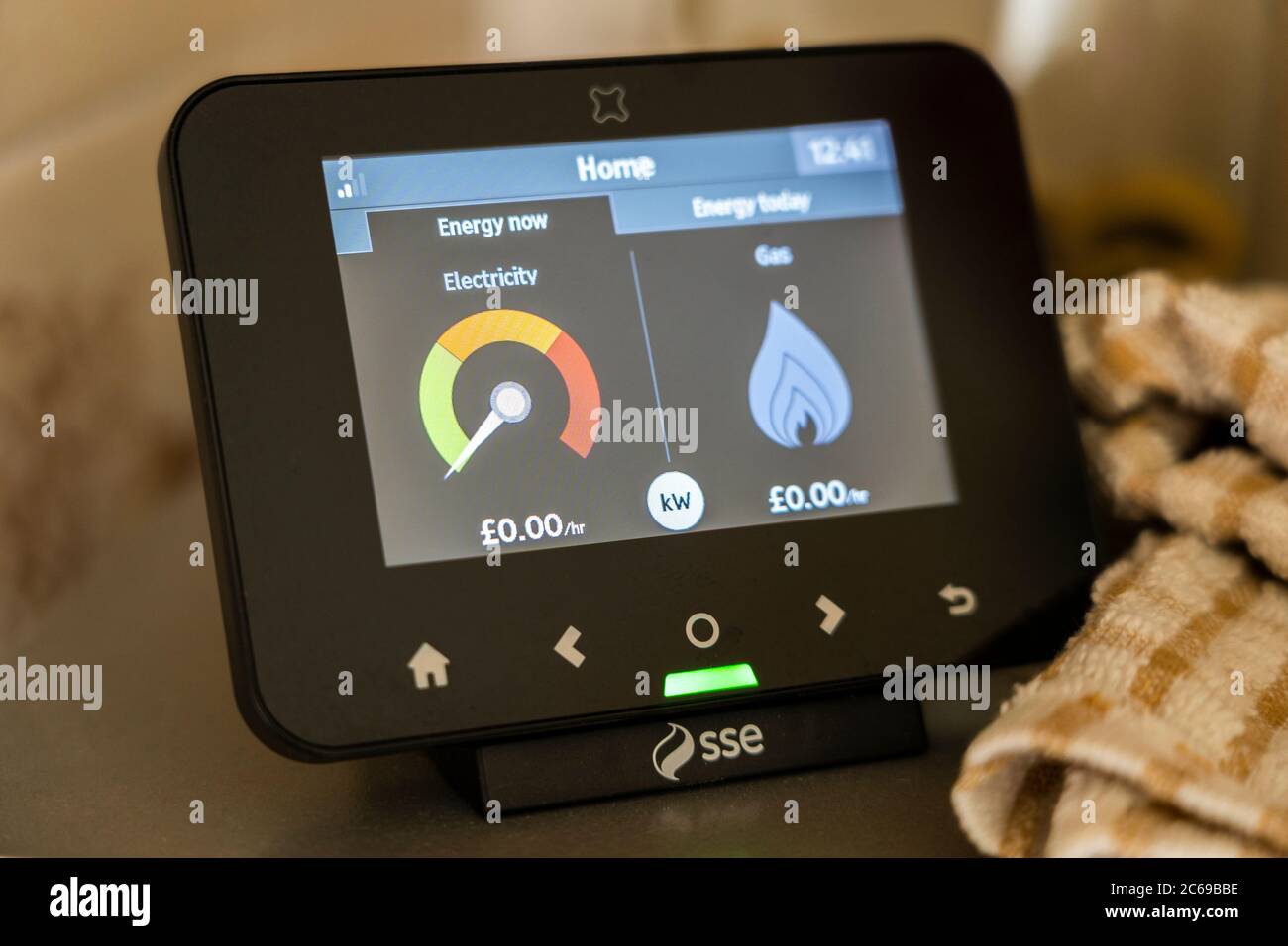A smart energy meter provided by SSE plc in the kitchen of a UK household, measuring electricity and gas usage Stock Photo