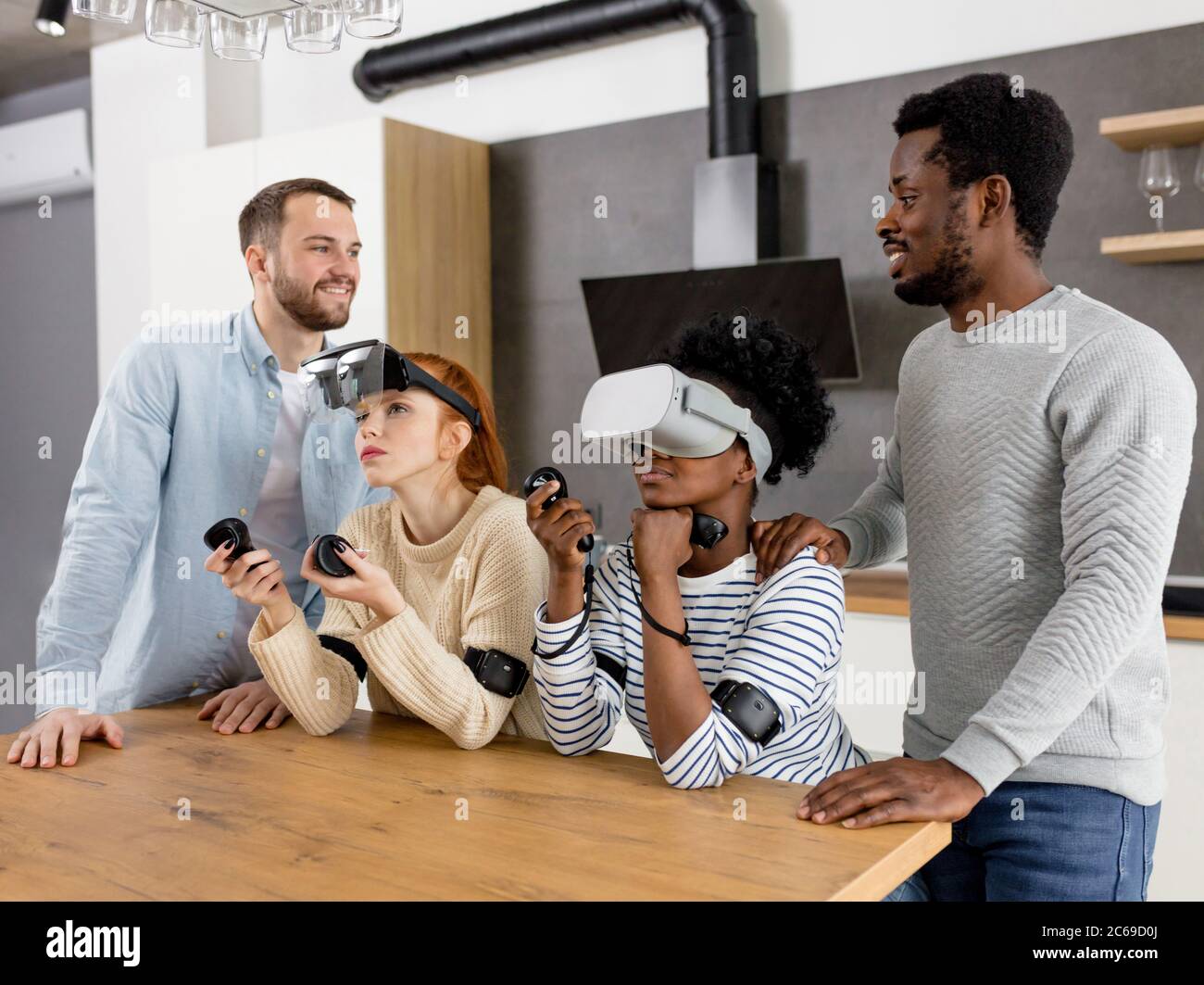 Group of young multicultural diverse friends play at home with internet ...