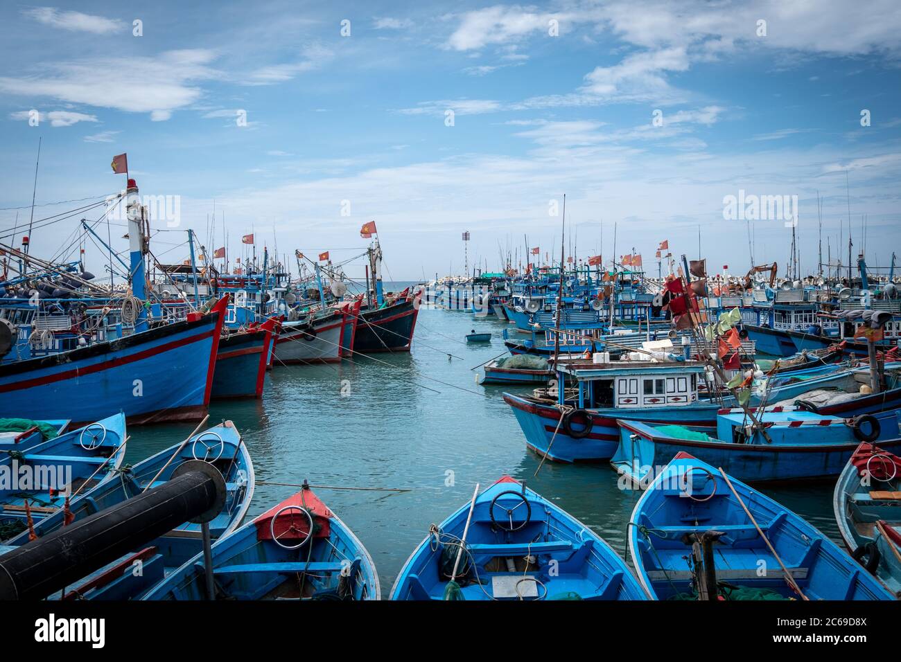 Traditional fishing boats moored in a harbour, Vietnam Stock Photo