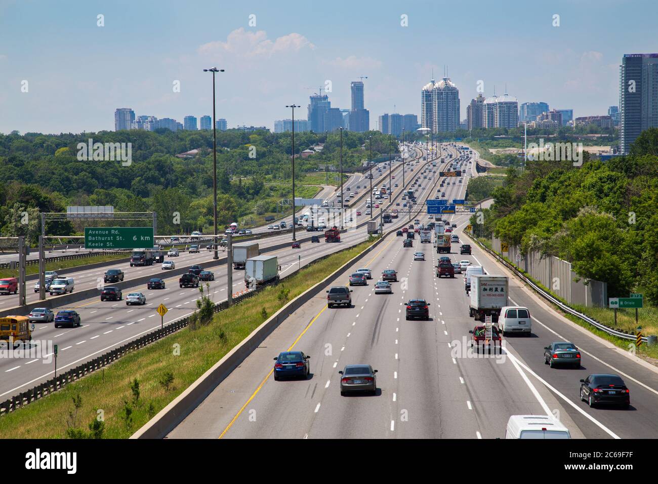 TORONTO, CANADA - JUNE 16, 2014: High view of part of Highway 401 running through Toronto during the day with lots of traffic. Stock Photo