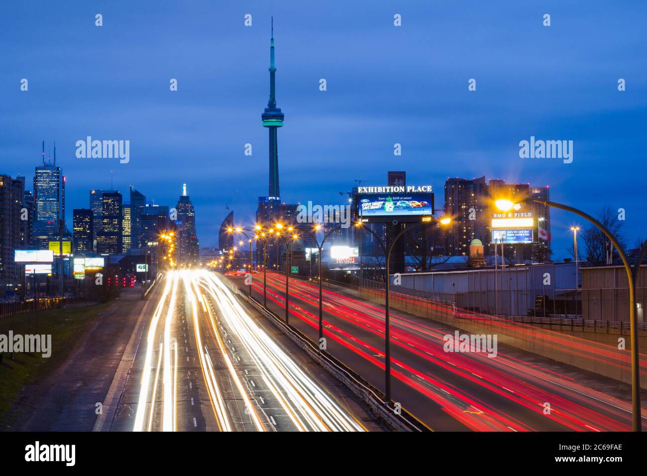 TORONTO, CANADA - 22ND APRIL 2014: Light trails on the  Gardiner Expressway leading up to the CN Tower and Downtown Toronto Stock Photo