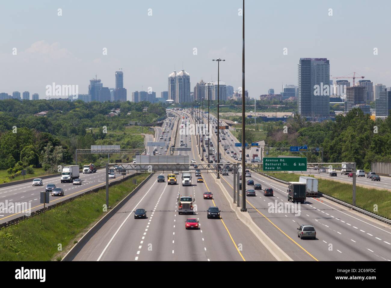 Part of Highway 401 in Toronto during the day showing the blur of traffic on the road Stock Photo