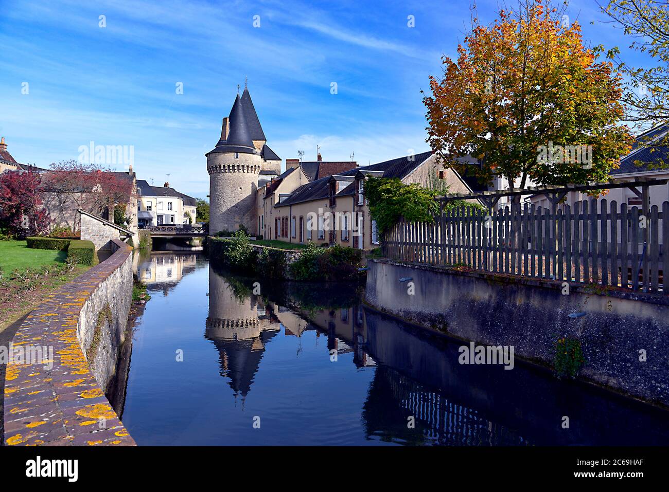 Keep of the fortified gate Saint-Julien on the Huisne river with big reflection at La-Ferté-Bernard, a commune in the Sarthe department in France Stock Photo