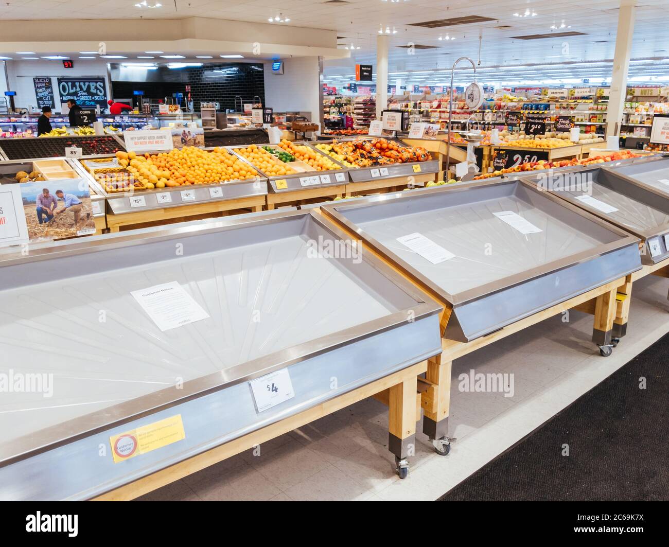 Empty Food and Product Shelves at an Australian Supermarket Stock Photo