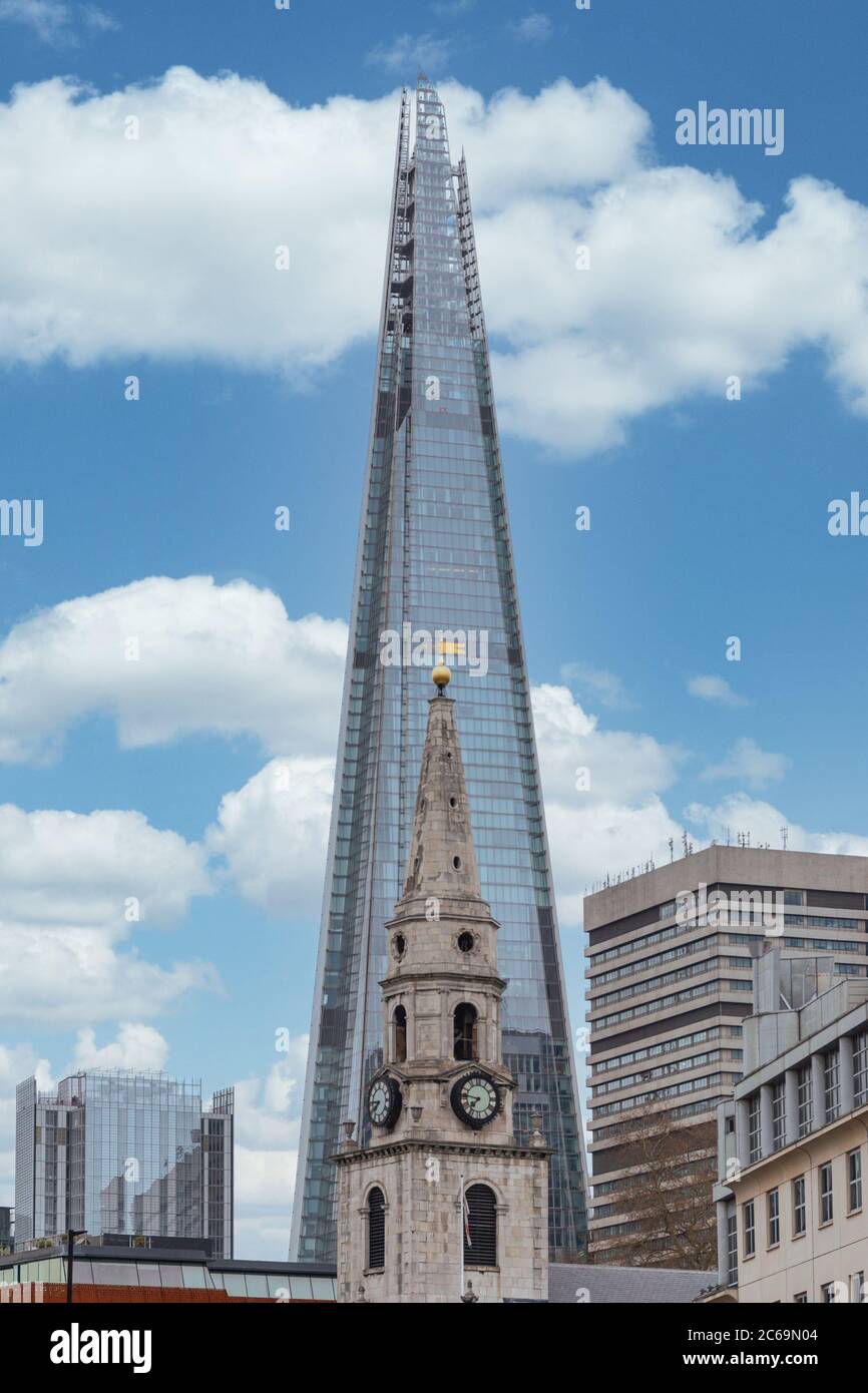 London, England - April 02, 2020: St. George the Martyr church, with the Shard building in the background, on Borough High St in Southwark, London, England Stock Photo