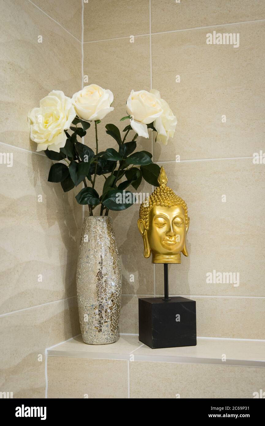 Vase of flowers in a tiled bathroom Stock Photo Alamy