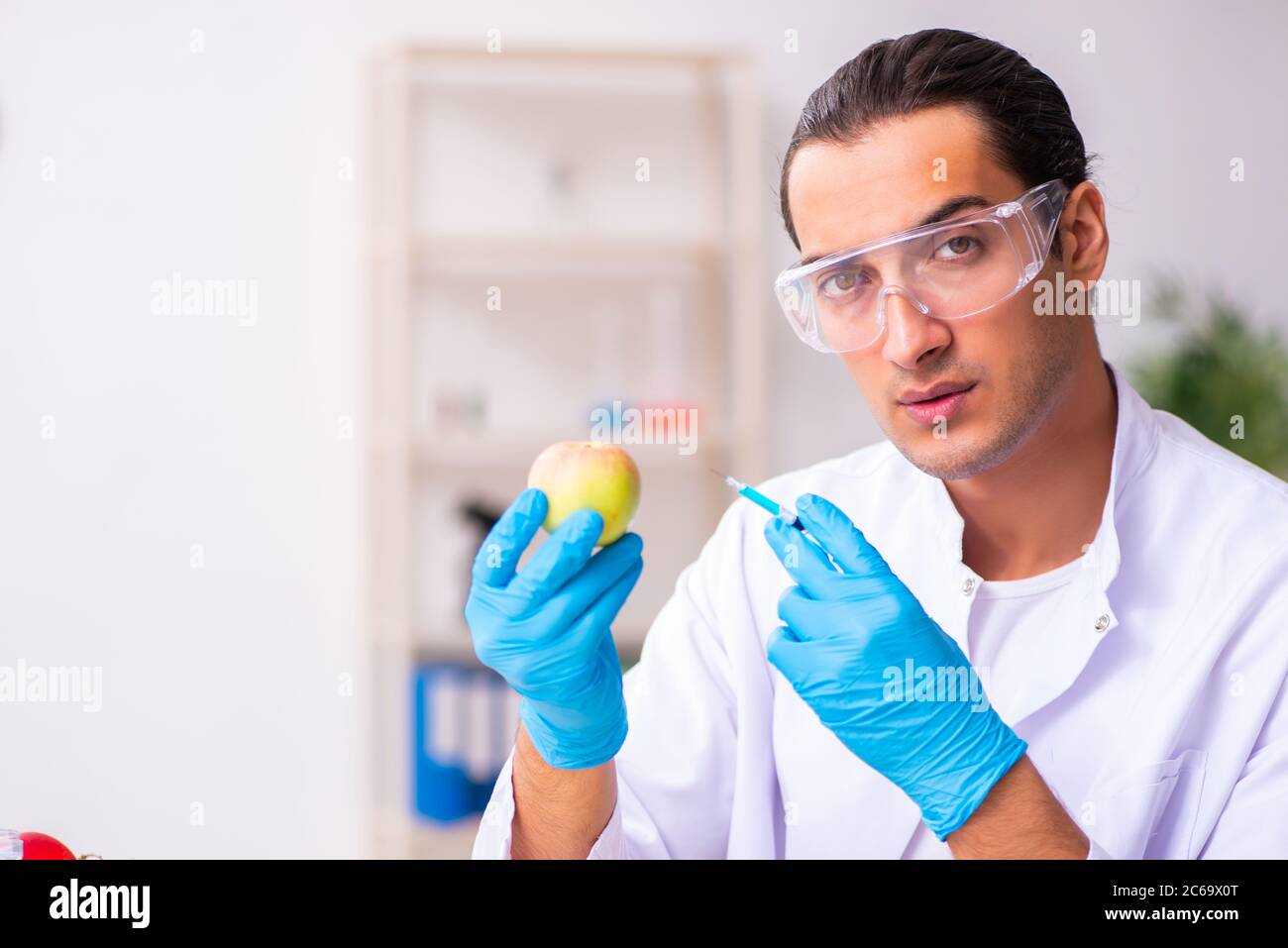Young nutrition expert testing food products in lab Stock Photo Alamy