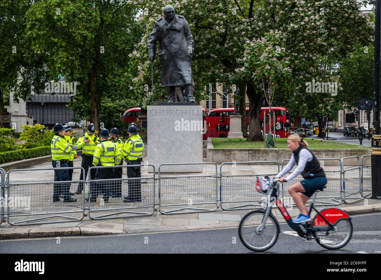 London, UK. 08th July, 2020. Police guard the Churchill memorial, in case there is trouble - Pro Europe Sodem, led by Steve Bray, protest timed for Chancellor - Chancellor, Rishi Sunak leaves No.11 Downing Street, to deliver a summer economic update in a statement to Parliament. It will not be a Budget but more like the Spending Review. Credit: Guy Bell/Alamy Live News Stock Photo