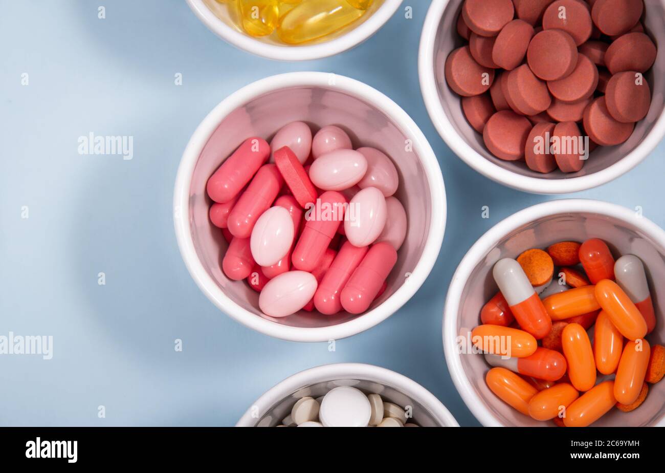 Colored tablets and capsules are removed from the package. Colored ...