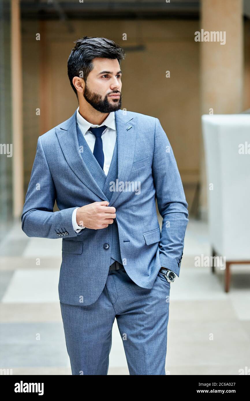 Graceful bearded brunette male looking away, posing in street. One hand in  pocket. Outdoors background Stock Photo - Alamy, image size:866x1390