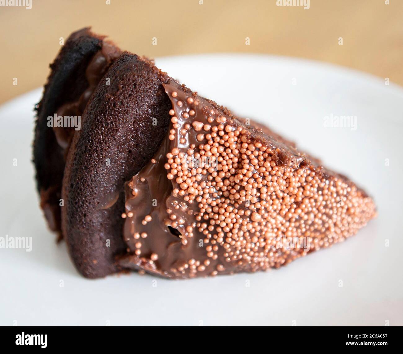 Chocolate cake with rose gold sprinkles Stock Photo