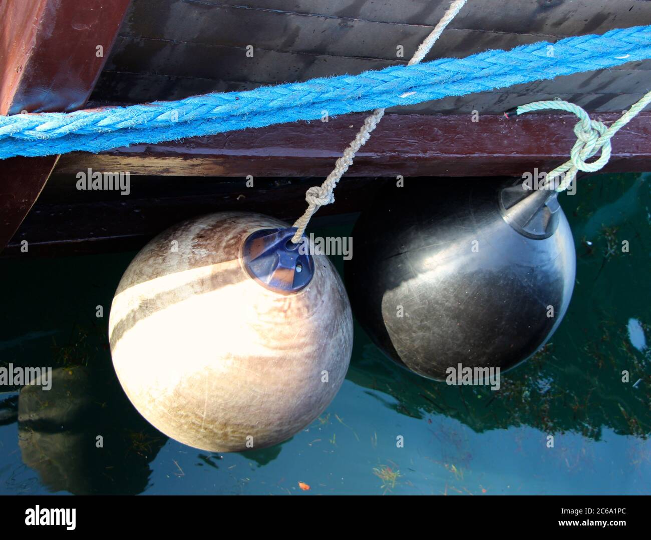 Protective mooring buoys close up Replica of the Victoria ship a
