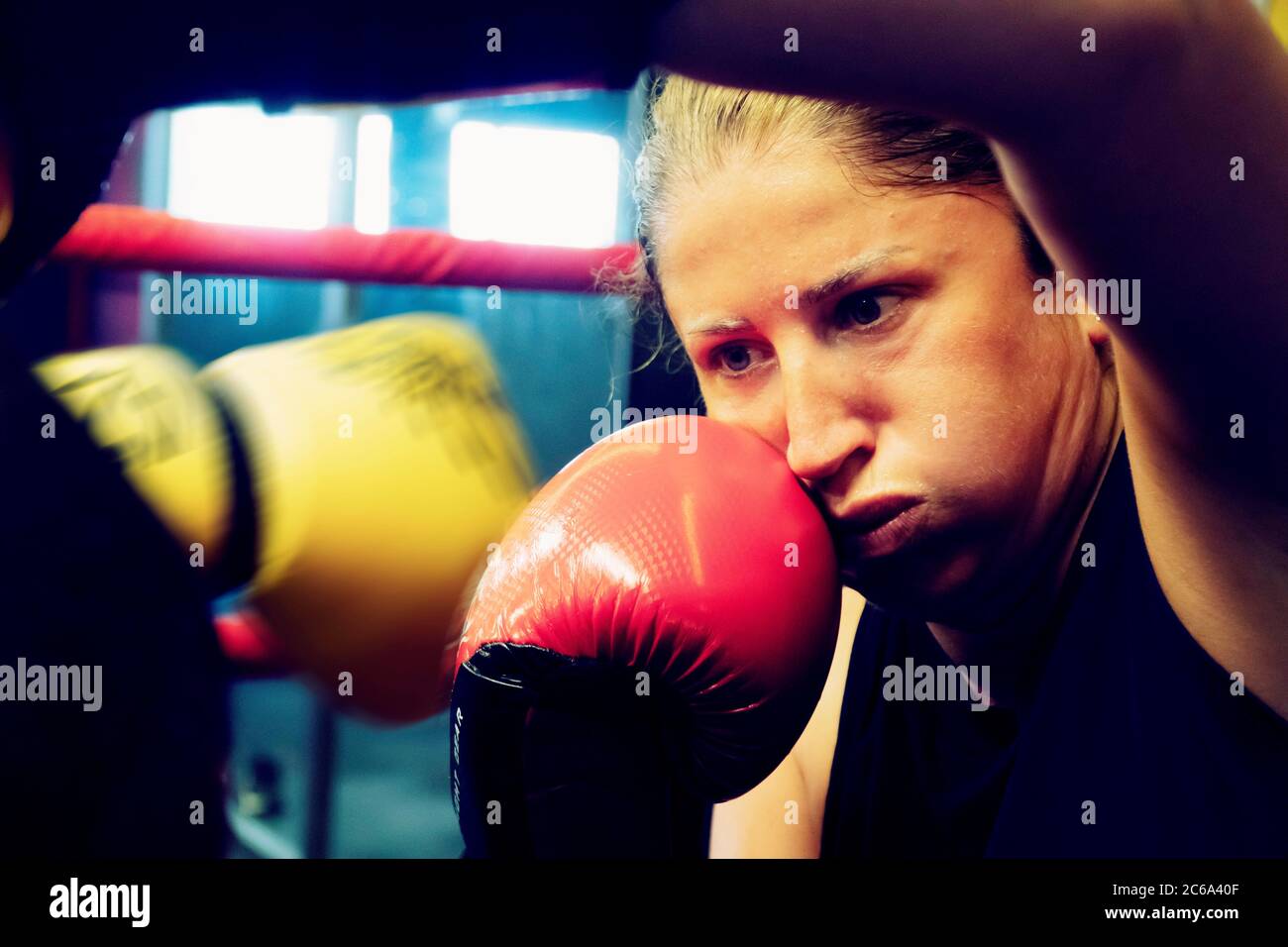 Young woman and her personal trainer working out kickbox for healthy life and self defence. Stock Photo