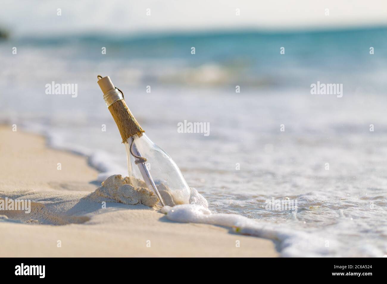 Bottle with a message, sea waves splashing on calm coast, shore. Exotic ...