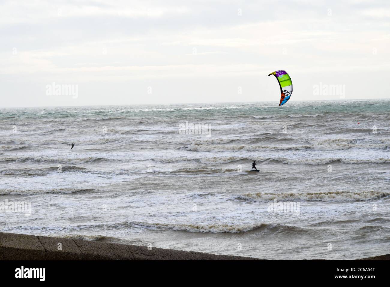 Kitesurfer is riding the waves hi-res stock photography and images - Alamy