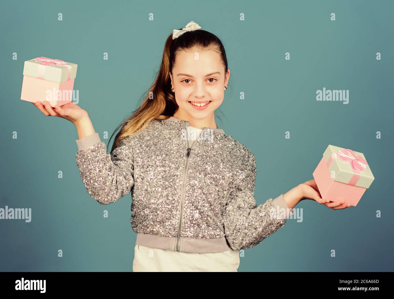 Shopping day. Cute child carry gift boxes. Surprise gift box. Birthday wish list. World of happiness. Pick bonus. Special happens every day. Girl with gift boxes blue background. Black friday. Stock Photo