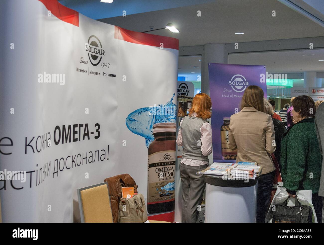 KYIV, UKRAINE - SEPTEMBER 24, 2014: People visit Solgar American food supplements and vitamins company booth by Nature's Bounty Co. at XV National Con Stock Photo