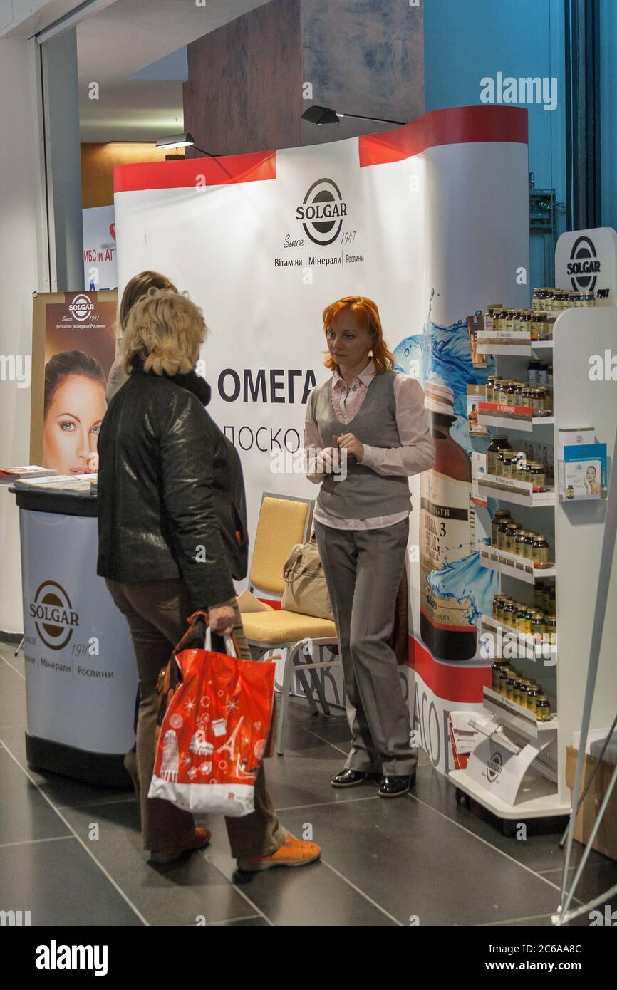 KYIV, UKRAINE - SEPTEMBER 24, 2014: People visit Solgar American food supplements and vitamins company booth by Nature's Bounty Co. at XV National Con Stock Photo