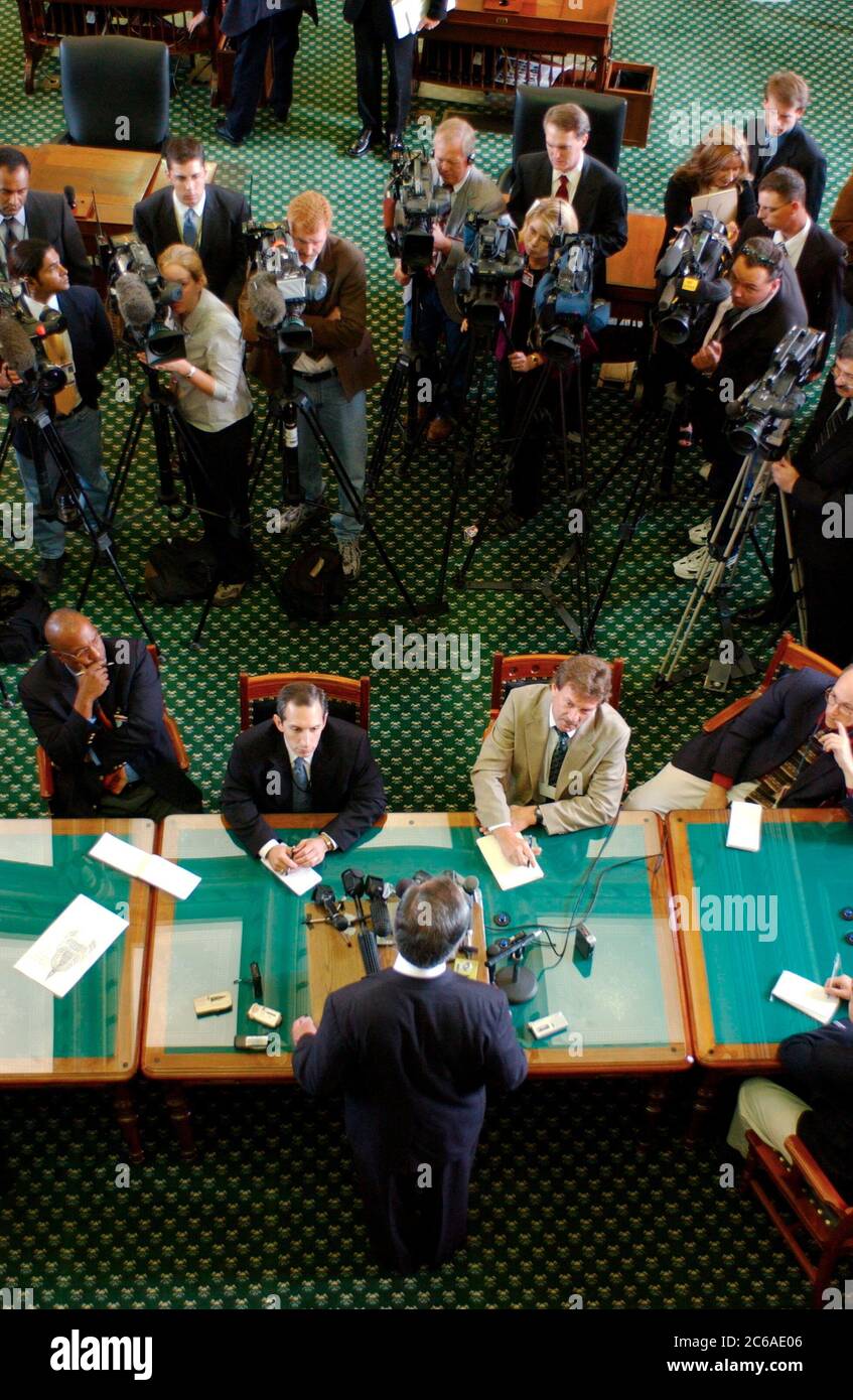 Austin, Texas USA, August 26, 2003: The second called Special Session of the 78th Texas Legislature ends 'sine die' at the State Capitol with an impasse over redistricting still in progress. Republican Senators talk with the press to get their Democratic colleagues, who walked out to show their opposition to the partisan redistricting plan, back to Austin. Lieutenant Gov. David Dewhurst stands at bottom center. ©Bob Daemmrich Stock Photo