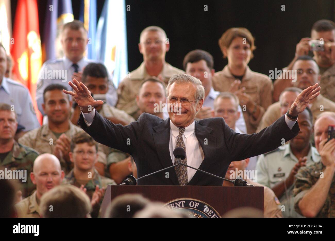 San Antonio, Texas USA, August 25, 2003: Secretary of Defense Donald Rumsfeld holds a town-hall style question-and-answer session with about 3,000 Texas troops in a hangar at Lackland Air Force Base, telling the troops that U.S. commanders say they have enough troops to combat guerilla attacks in Iraq. Rumsfeld answered questions for about an hour after touring the base. ©Bob Daemmrich Stock Photo