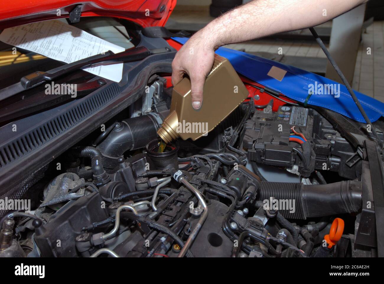 Adding Oil to a Car Stock Photo - Alamy