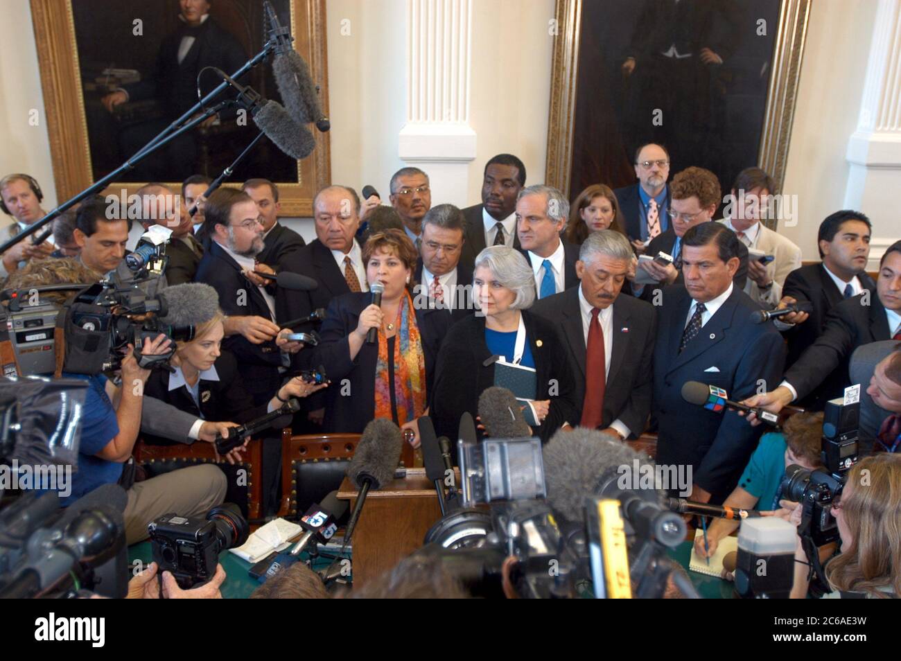 September 15, 2003: Texas' absent Democratic senators, who spent more than six weeks in exile in New Mexico, return Monday to the State Capitol to the rousing cheers of a Senate gallery packed with Democratic supporters.  Senate decorum was non-existent as legislators, media and spectators swarmed the chamber in a historic moment for Texas. ©Bob Daemmrich Stock Photo