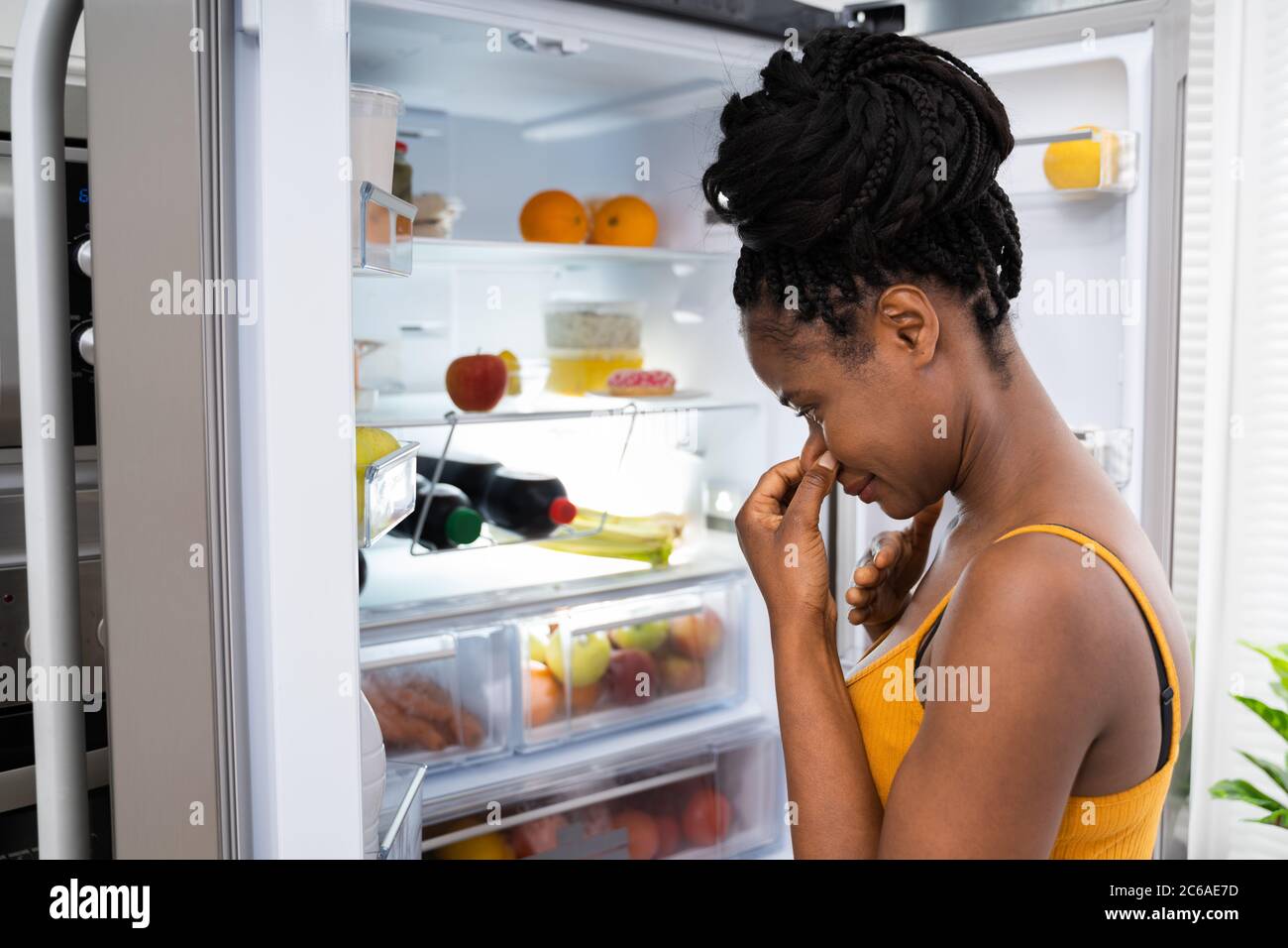 Rotten Fruit Bad Smell In Open Fridge Or Refrigerator Stock Photo