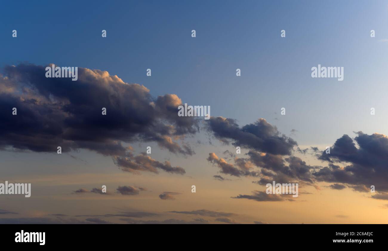 Dramatic sunset sky with orange colored clouds Stock Photo - Alamy