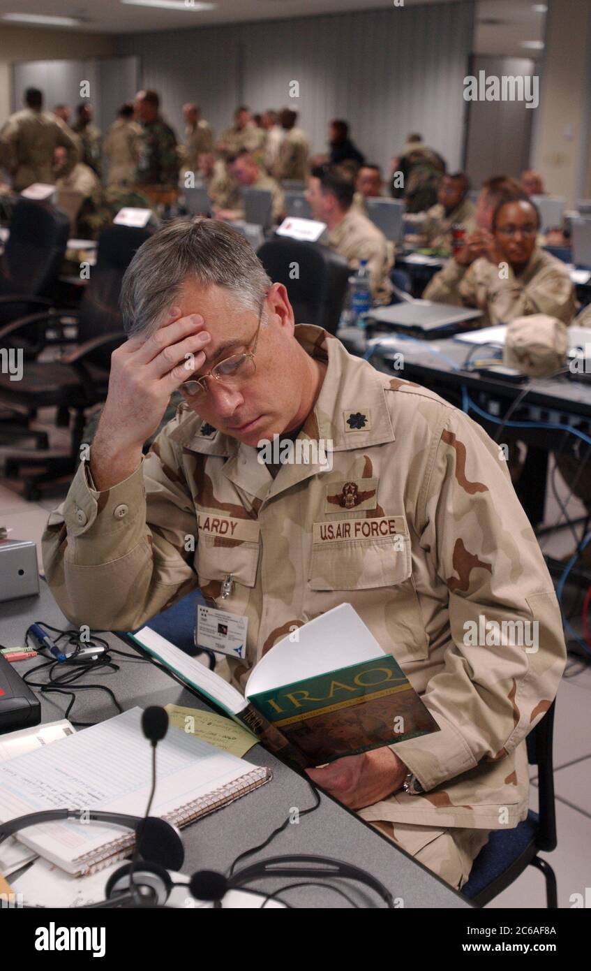 Fort Hood, Texas USA, December 12, 2003: Air Force Lt. Col. Bob Clardy reads a book on Iraqi culture during a break in simulated battle operations at III Corps headquarters on Friday. Thousands of troops are preparing for deployment of Combined Joint Task Force-7 to Iraq after the new year. Clardy received word of his deployment last week. ©Bob Daemmrich Stock Photo