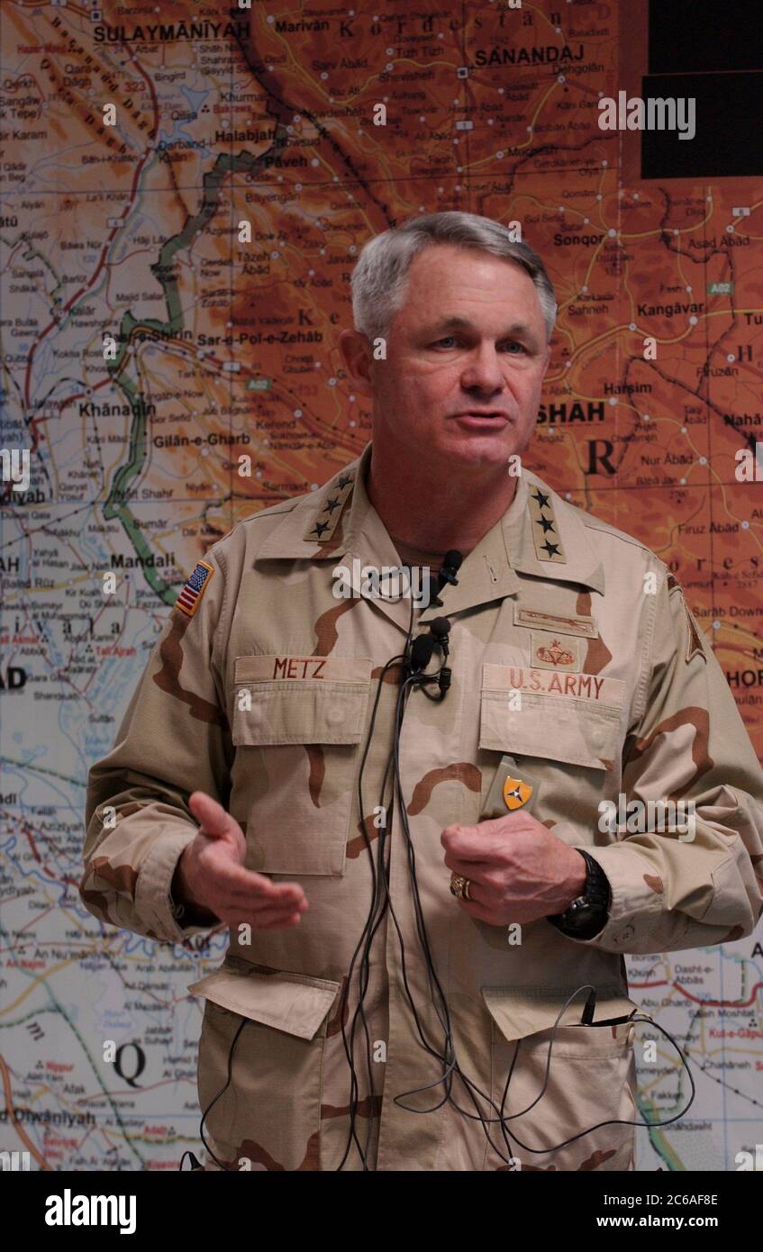 Fort Hood, Texas USA, December 12, 2003: U.S. Army Lt. Gen. Thomas Metz, commander of III Corps at Fort Hood, stands in front of a map of Iraq at the sprawling military base in central Texas. Metz will take over this spring for Lt. Gen. Ricardo Sanchez, who is now in command of Army ground troops in Iraq.  ©Bob Daemmrich Stock Photo