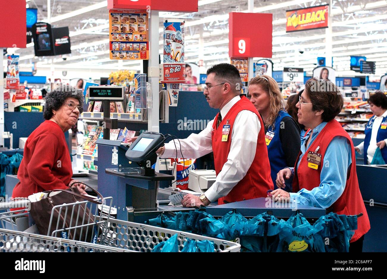 San Antonio, Texas January 21, 2004 Associates check out a cash