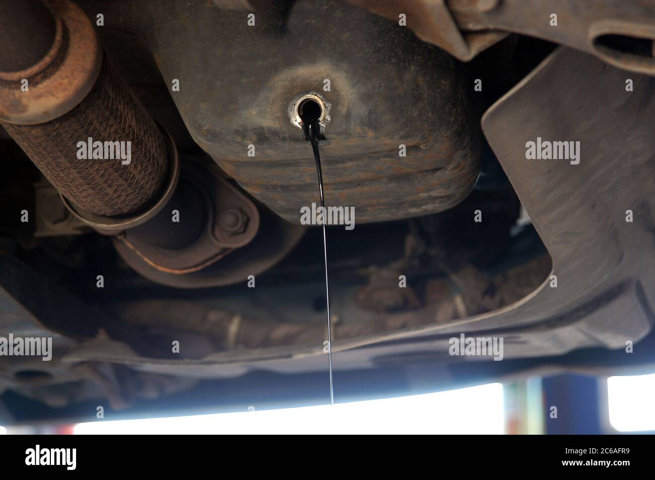 Oil leaking from the riverbed car engine Stock Photo Alamy
