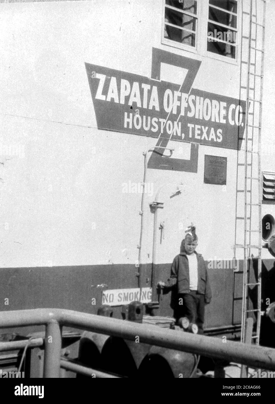 HS319 W. Bush stands in front of the Zapata Offshore Company in