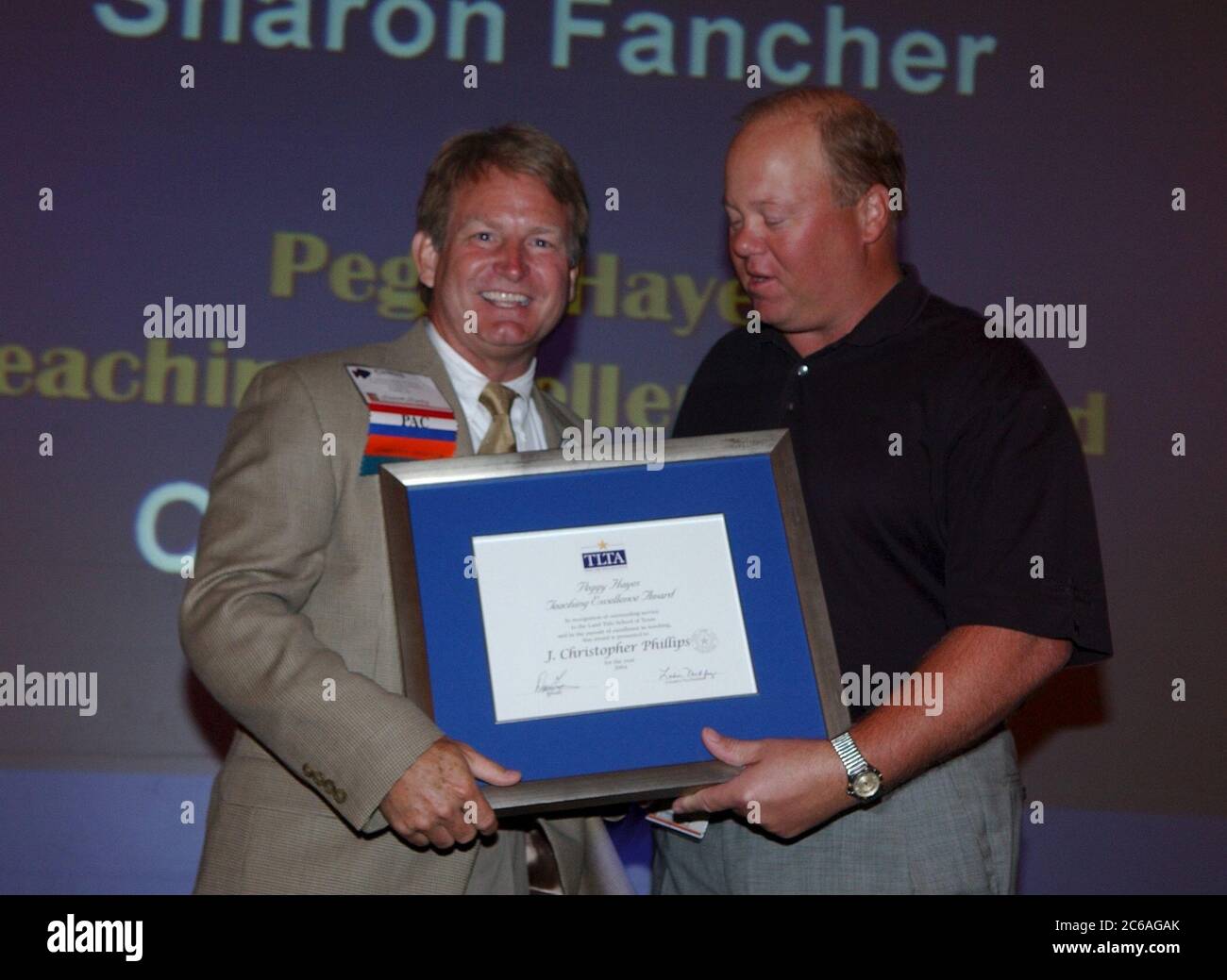 Corpus Christi Texas USA, June, 2004: White male presents award to white male during formal dinner at professional association convention.  ©Bob Daemmrich Stock Photo