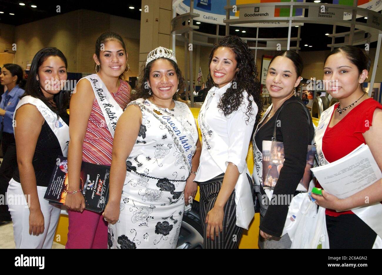 San Antonio, Texas USA, July 2004: Teen beauty queens from Corpus Christi, Texas pose on the trade show floor at at the League of United Latin American Citizens (LULAC) National Convention. ©Bob Daemmrich Stock Photo