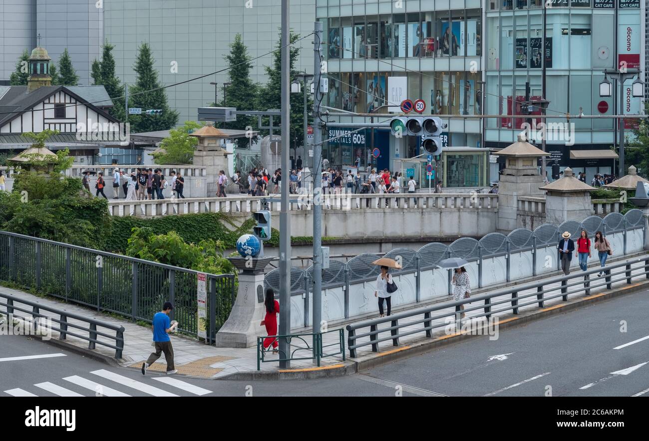 Pedestian at Harajuku's Jingu Bashi or shrine bridge, Tokyo, Japan Stock Photo