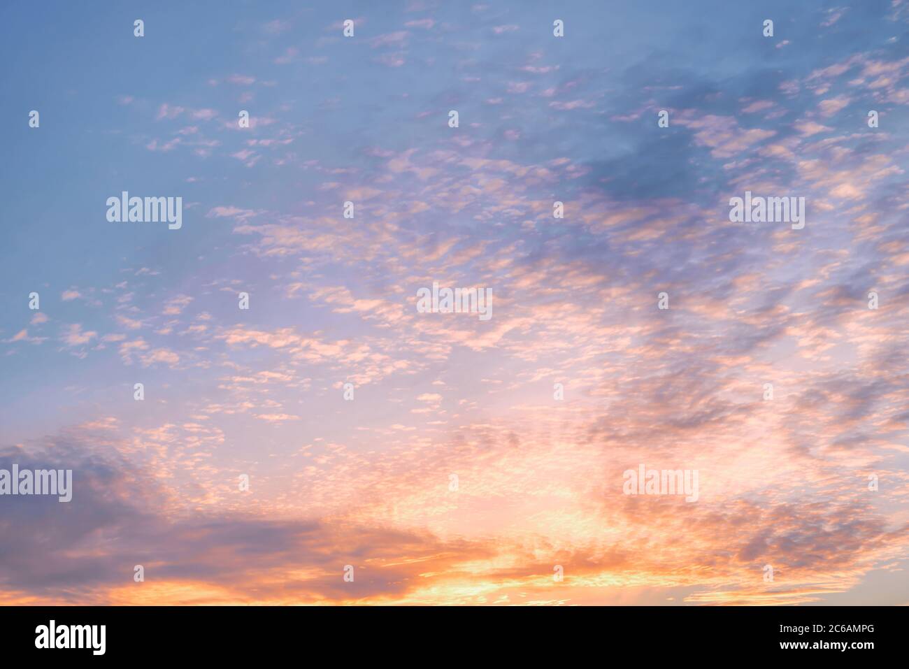 Dramatic cloudy golden colored sunset sky. Natural background Stock Photo