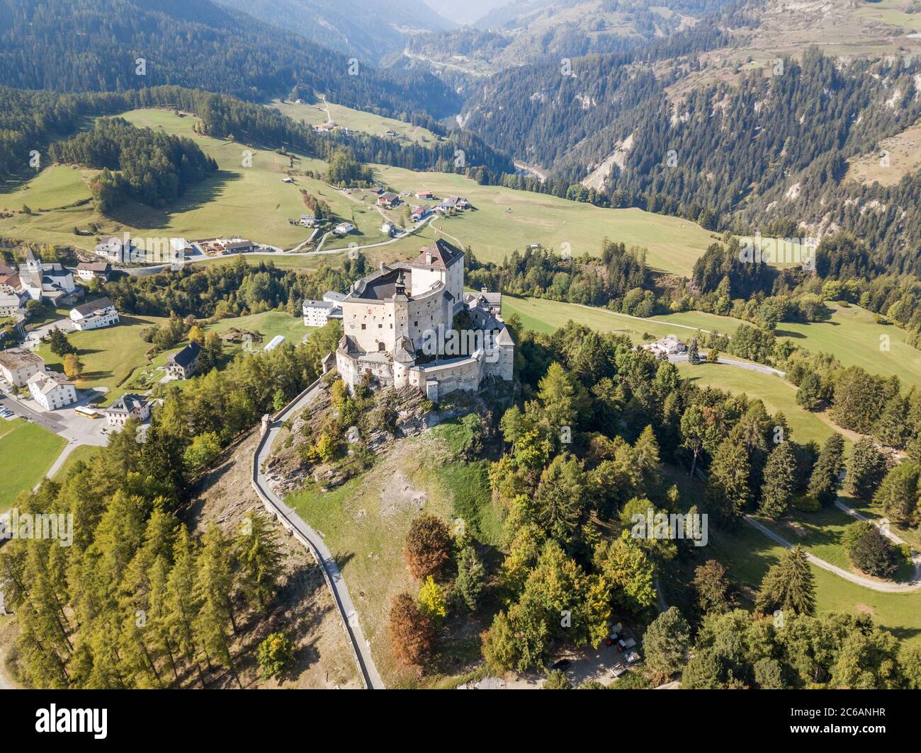 Aerial view of Castle Tarasp (built in the 11th century) in Swiss Alps ...