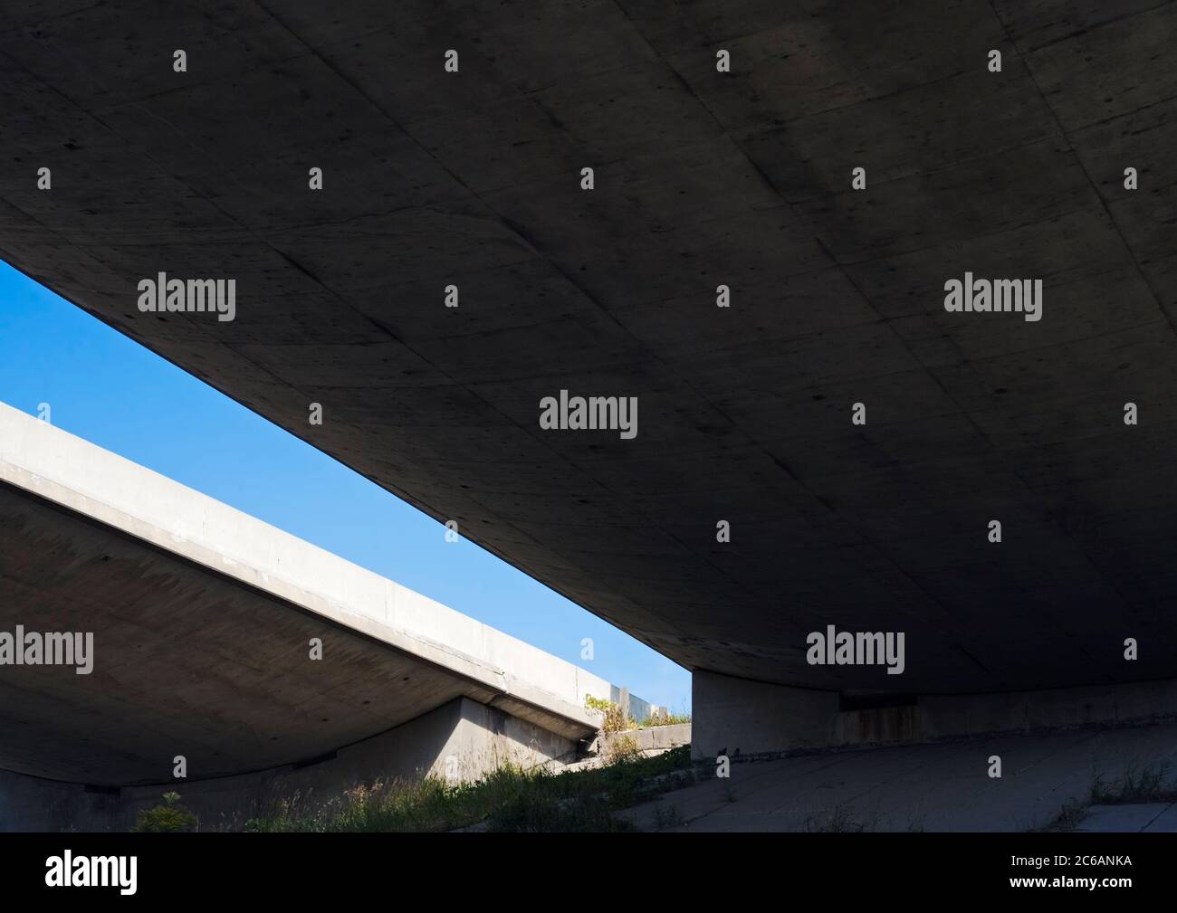 under,bridge,road,viaduct,aqueduct,flyover,overpass,gap,light,blue,sky,concept,going down,grave,closing, Stock Photo